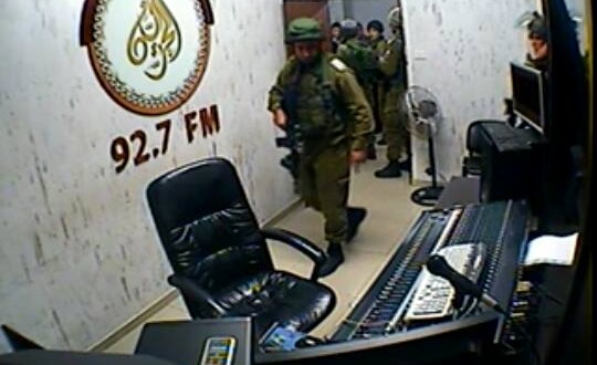 Israeli troops invading Palestinian radio station. Picture:Palestine News Network. 